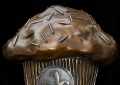 CUPCAKE SIGN, A bronze cupcake sign, designed for The Cupcake Tree Bakery in Santa Clarita, CA. The oversized bronze cupcake relief includes the shop's logo